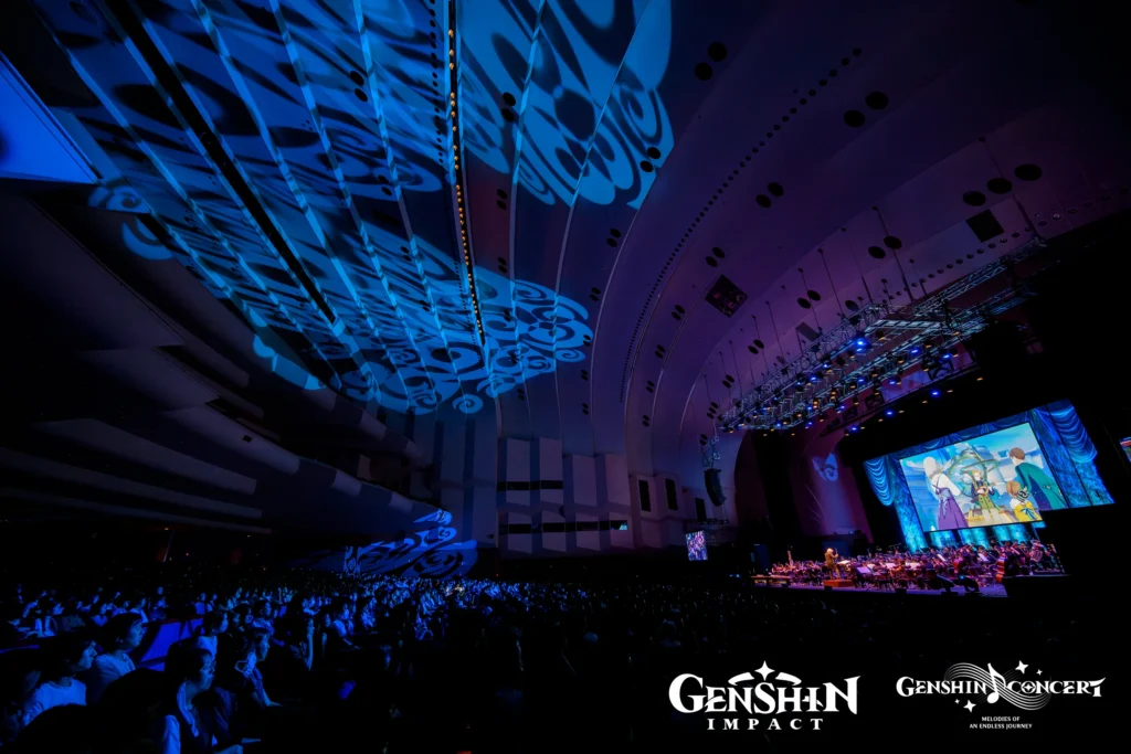 Genshin Impact concert featuring live orchestra with stunning visuals, showcasing music composed by HOYO-MiX which is under Hoyoverse.